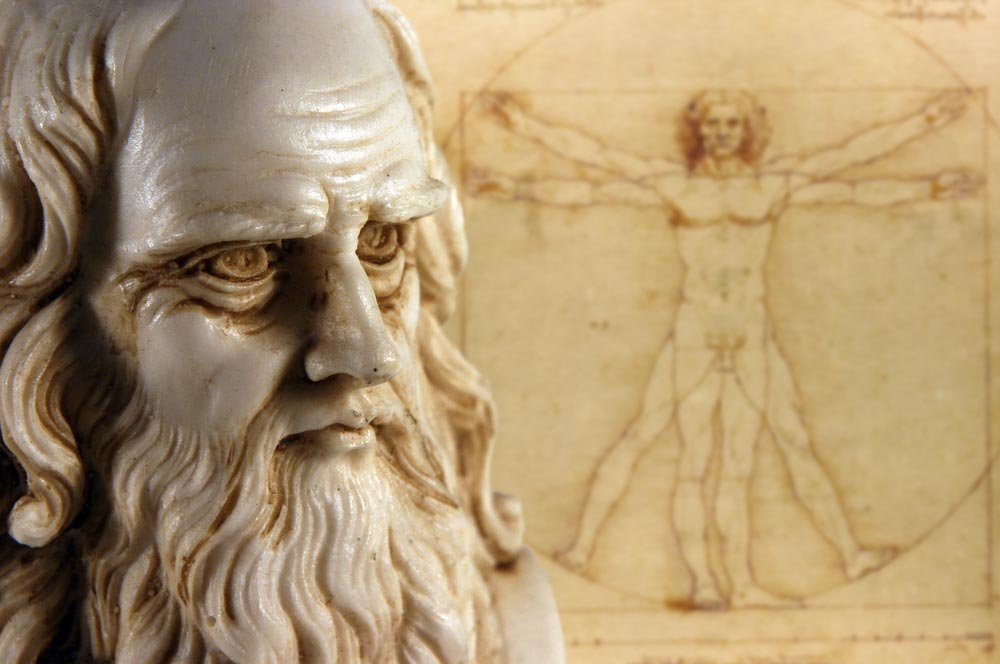 Busta Leonarda da Vinci s dlouhým vousem před jeho kresbou Vitruviánského muže